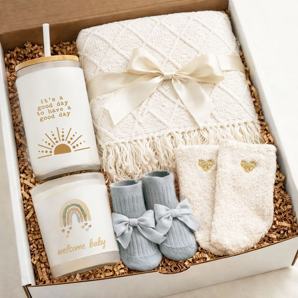 New Baby Gift Box – New Mom Gift Box - Baby Boy Gift Box featuring cozy essentials for new parents, including socks and a blanket.